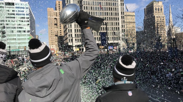 Foles holds the trophy aloft approaching LOVE Park
