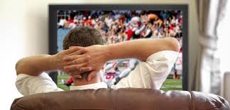 guy watching football.jpeg