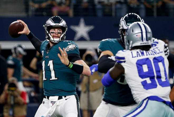 lane jonson stonewalls demarcus lawrence as carson wentz sets to deliver.